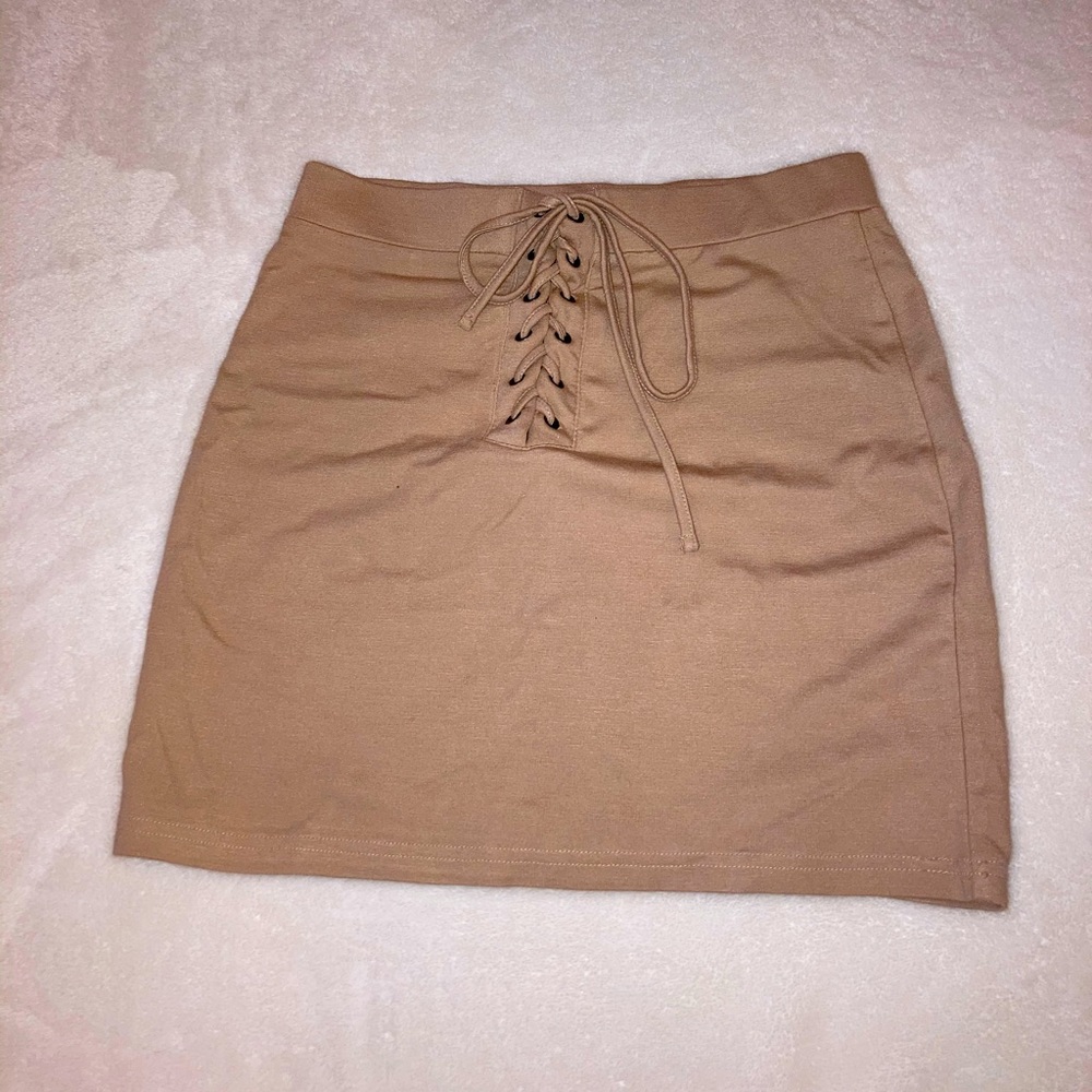 tan/nude skirt, cute lace up front